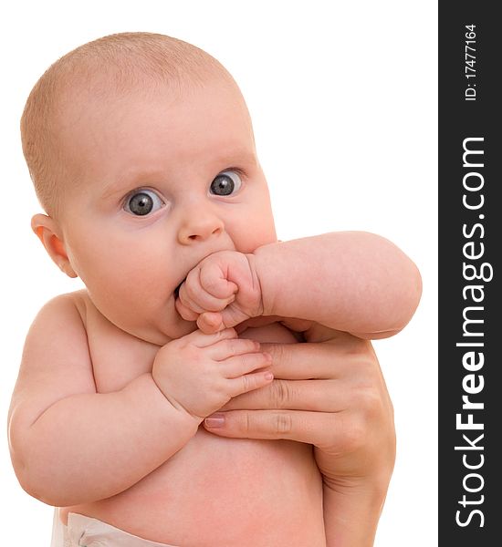 Surprised kid looks at a white background.