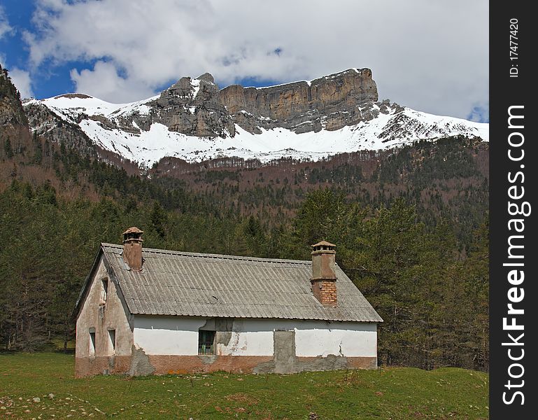 Hut And Snow-covered Mountains In Pyrenees