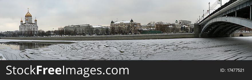 Panoramic view of the Moscow River, Cathedral of Christ the Savior and the Great Stone Bridge on a cloudy winter day, Moscow, Russia
