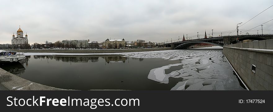 Panoramic view of the Moscow River, Cathedral of Christ the Savior and the Great Stone Bridge on a cloudy winter day, Moscow, Russia. Panoramic view of the Moscow River, Cathedral of Christ the Savior and the Great Stone Bridge on a cloudy winter day, Moscow, Russia