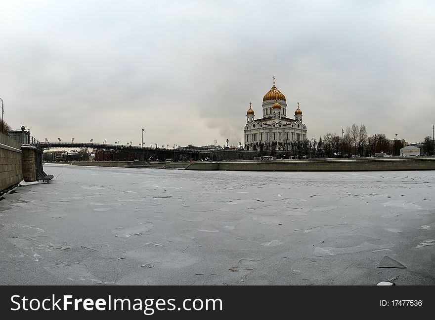 Panoramic view of the Moscow River, Cathedral of Christ the Savior and the Great Stone Bridge on a cloudy winter day, Moscow, Russia. Panoramic view of the Moscow River, Cathedral of Christ the Savior and the Great Stone Bridge on a cloudy winter day, Moscow, Russia