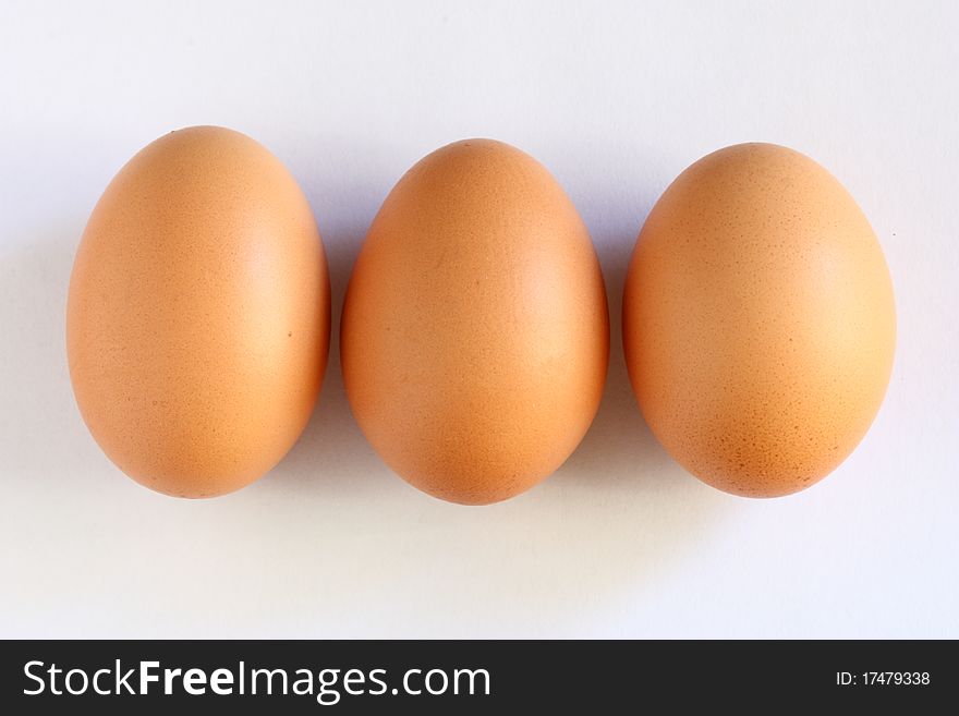 Three eggs close one another and horizontally aligned