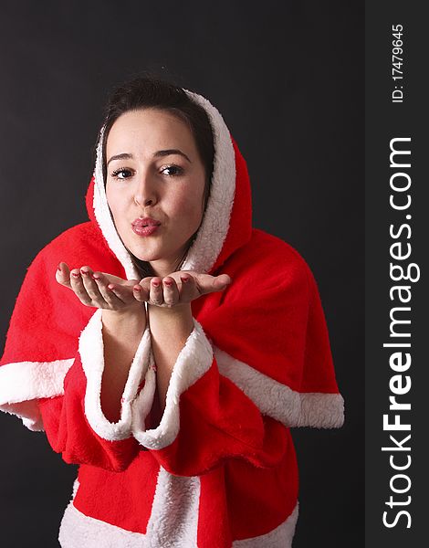 Santa girl sends us a kiss,black background