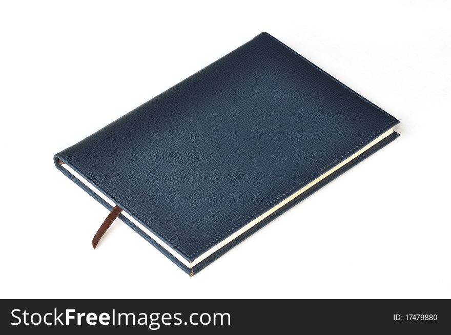 Navy leather notebook on white background.