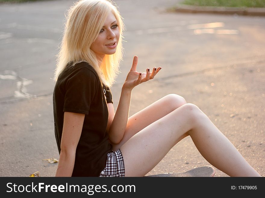 Young caucasian teen with skate on the street