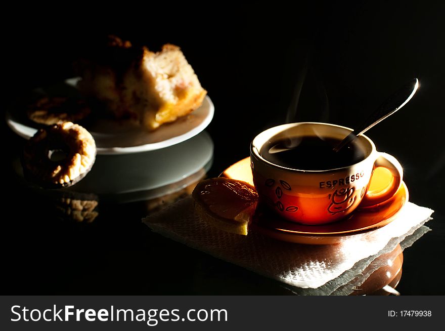 Cup of coffee, saucer with a cake and cookie. Cup of coffee, saucer with a cake and cookie