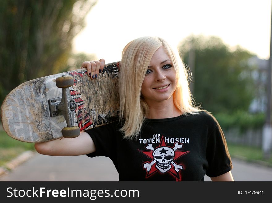 Young smiling caucasian teen with skate. Young smiling caucasian teen with skate