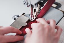 A Leather Craftsman Produces Leather Goods On A Sewing Machine In His Shop Royalty Free Stock Image