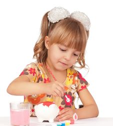 Girl With Piggy Bank Stock Image
