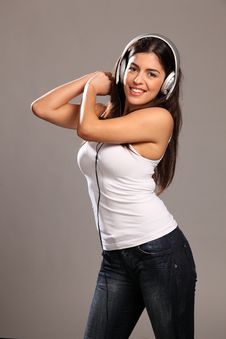 Beautiful Young Woman Happy And Dancing To Music Royalty Free Stock Images Beautiful Young Woman Happy And Dancing To Music Royalty Free Stock Images