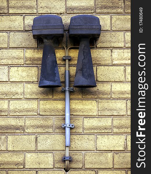 Alarm devices on a brick wall