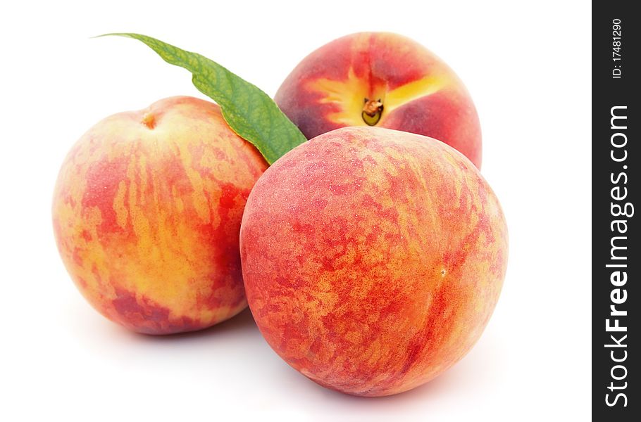 Ripe peaches on a white background