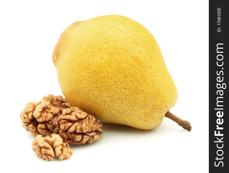 Pear and walnut on a white background