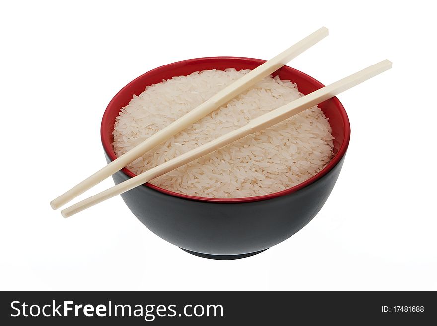 Rice, bowl with chopsticks isolated against white background