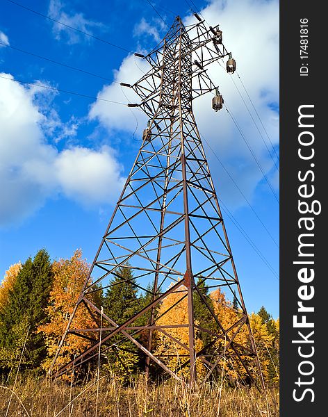 Power transmission towers standing in the woods in autumn. Power transmission towers standing in the woods in autumn.