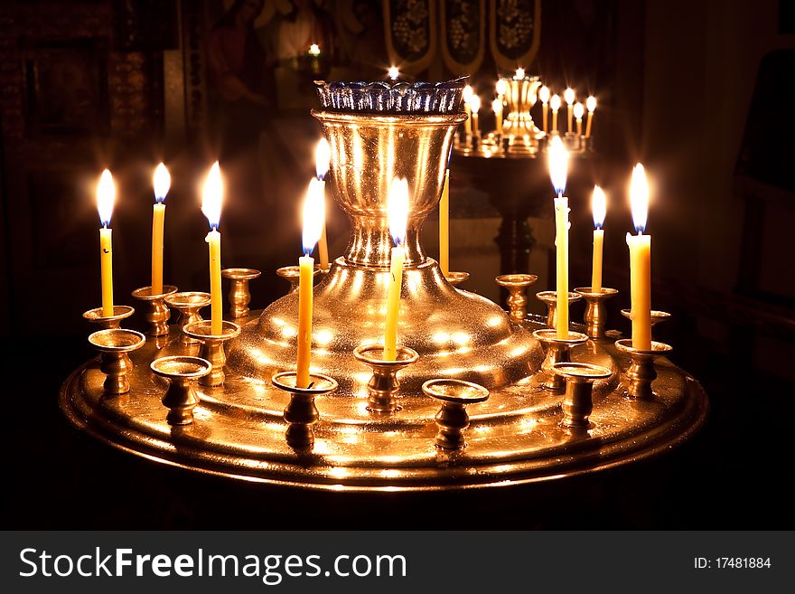 Candles and a lamp burning in the orthodox church. Candles and a lamp burning in the orthodox church.