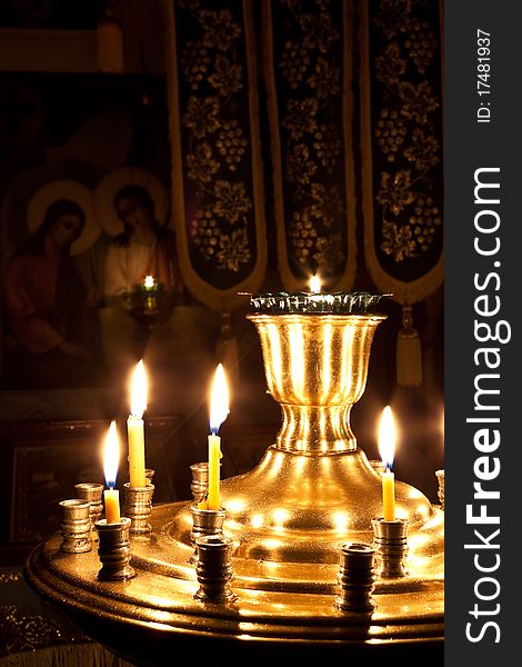 Candles and a lamp burning in the orthodox church. Candles and a lamp burning in the orthodox church.