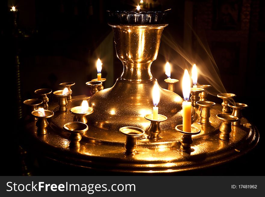 Candles and a lamp burning in the church.