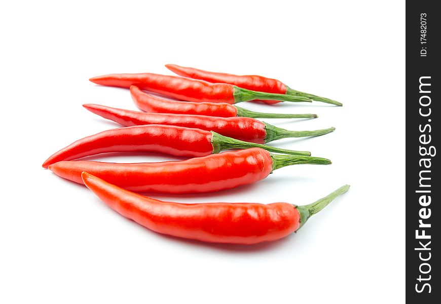 Red hot chili peppers on white background