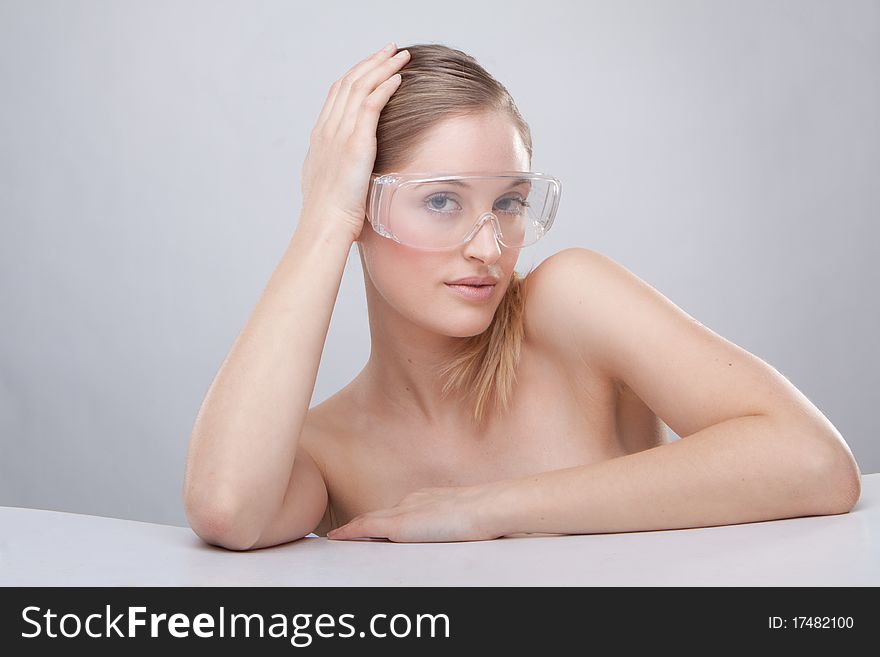 Woman wearing plastic protective goggles.