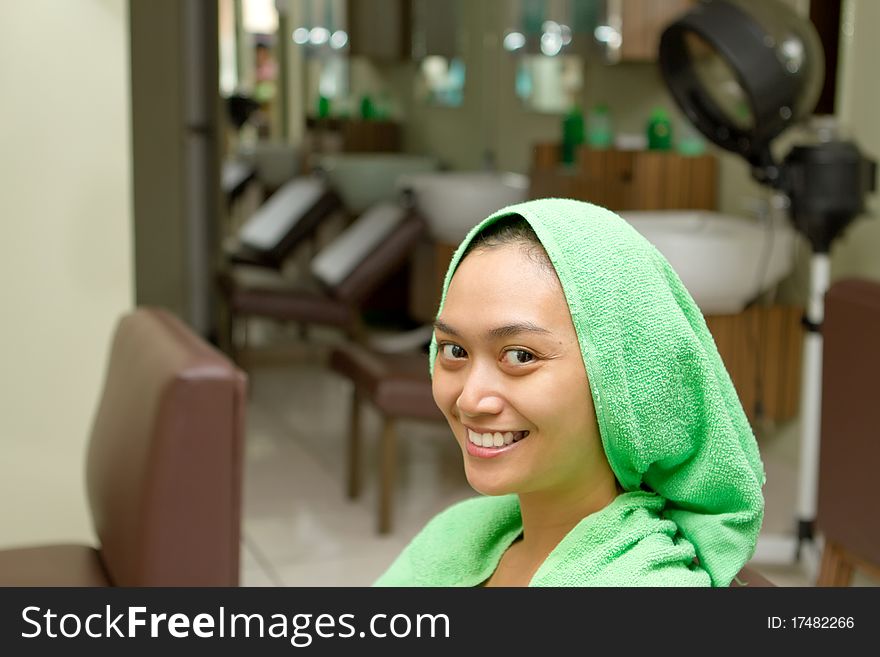 Happy asian ethnic young woman at hair salon. Happy asian ethnic young woman at hair salon