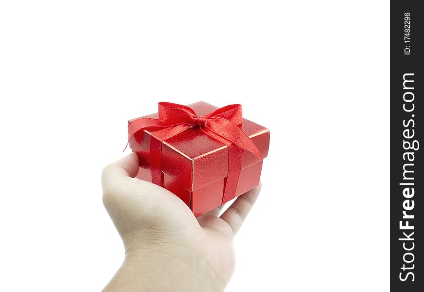 Red gift and human hand on white background. Red gift and human hand on white background