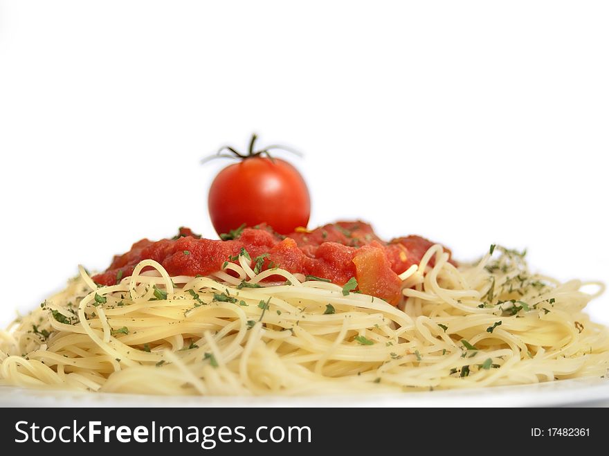 Plate of spaghetti with tomatoes, copy space, selective focus.
