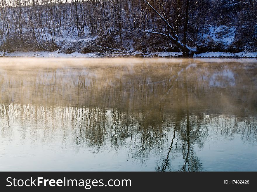 River in winter with  mist and snow. River in winter with  mist and snow