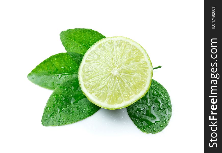 Green lemon with leaves on white background. Green lemon with leaves on white background
