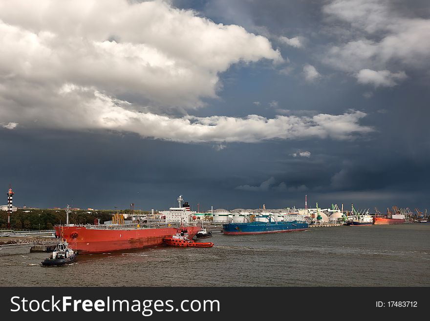 Harbor with big ships and stormy sky. Harbor with big ships and stormy sky