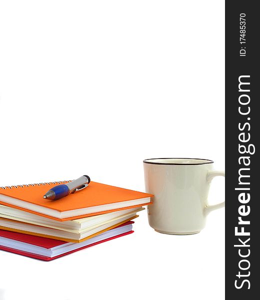White coffee cup on the note book