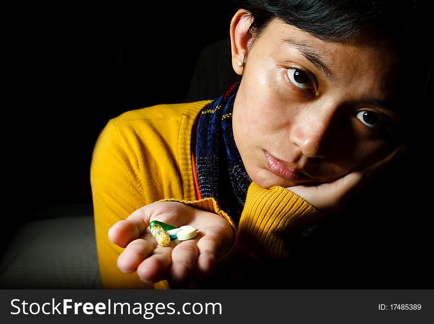 Asian ethnic young woman with allergic symptoms feel sad to take various pills. Asian ethnic young woman with allergic symptoms feel sad to take various pills