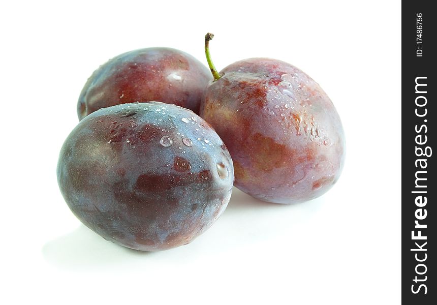 Ripe juicy plum with on a white background. Ripe juicy plum with on a white background