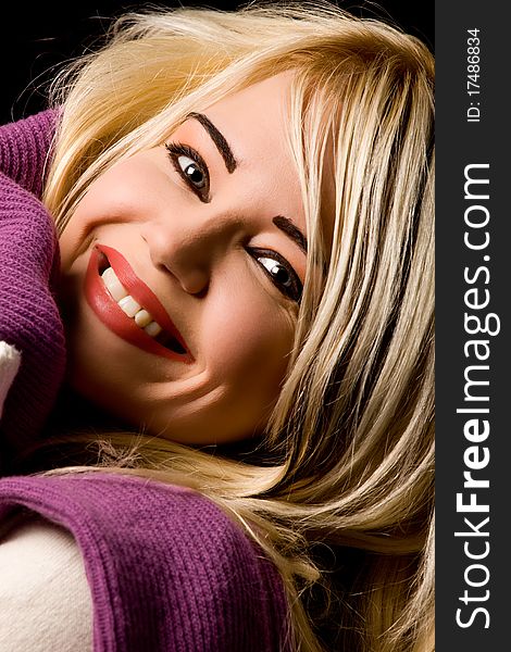 Photo of blond smiling woman with violet scarf
