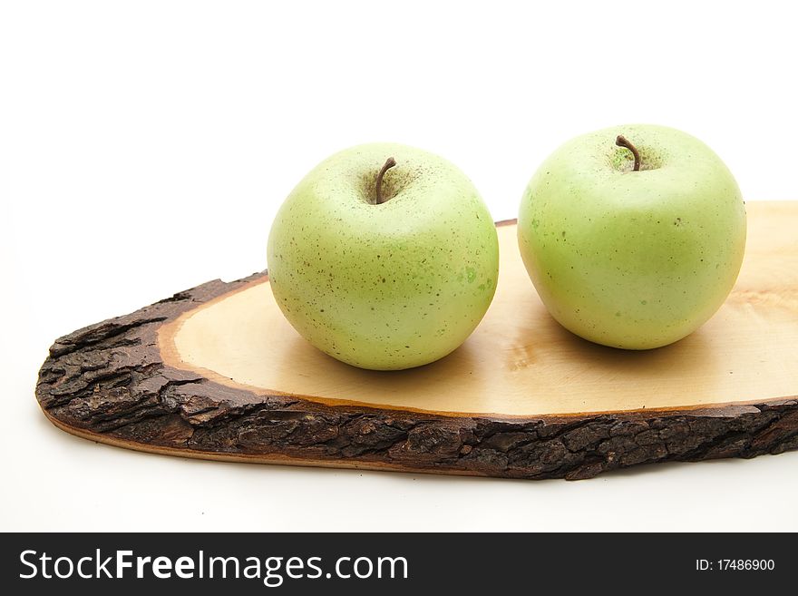 Apples on wood with bark