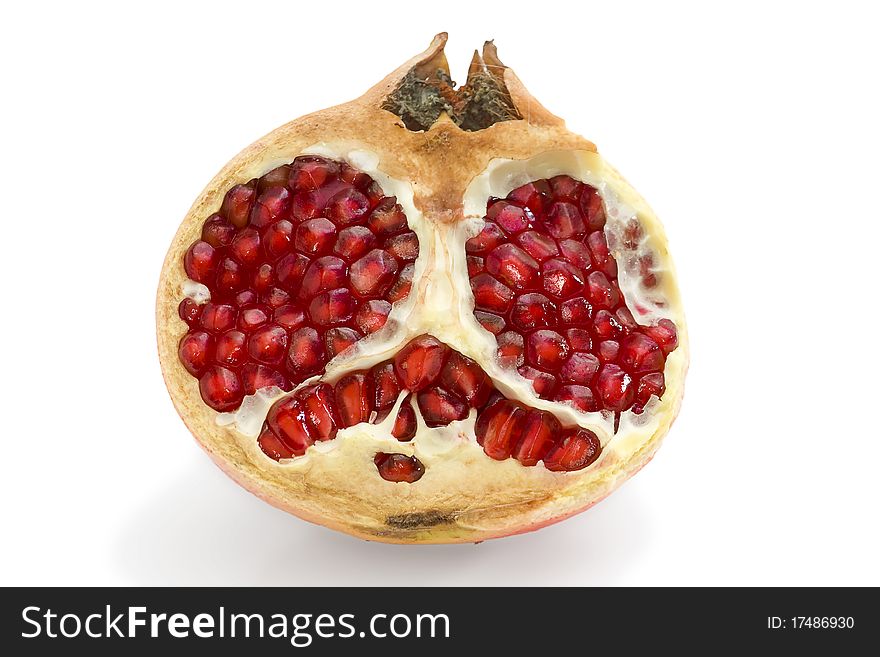 Falling pomegranate slices. Isolated on a white background