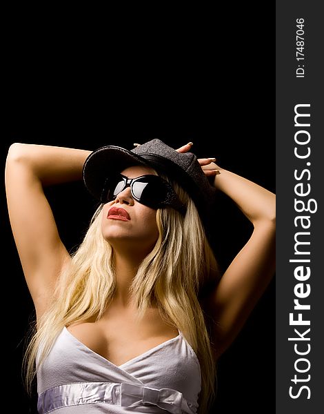 Photo of woman with white shirt wearing hat and sunglasses. Photo of woman with white shirt wearing hat and sunglasses