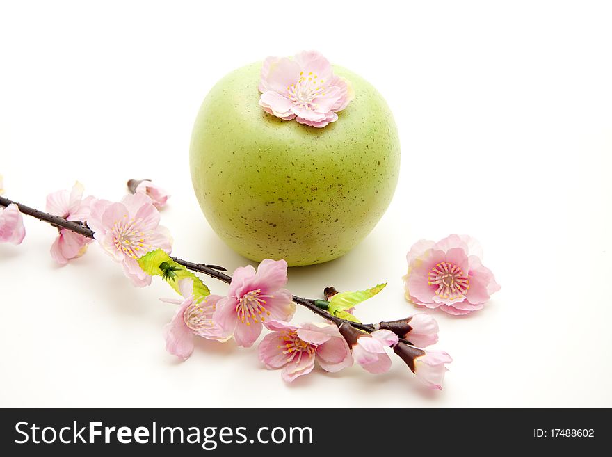 Green apple and branch with blossoms. Green apple and branch with blossoms