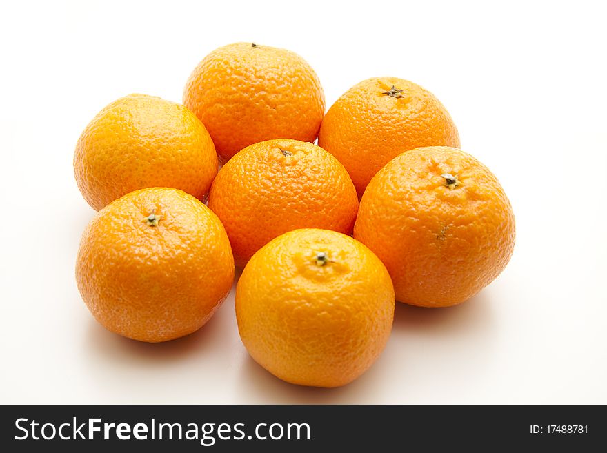 Tangerines with shell onto white background