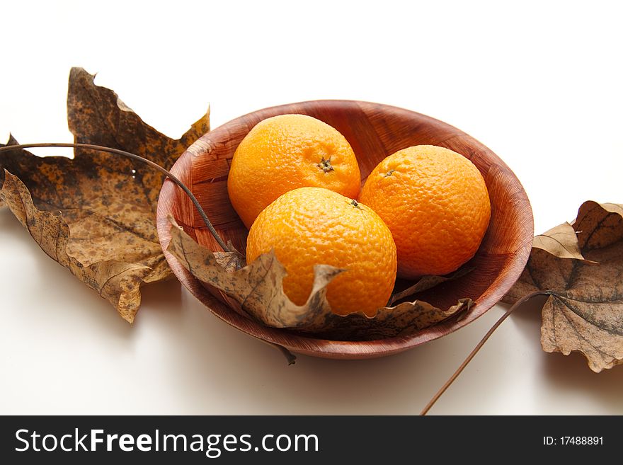 Tangerines in the wood bowl. Tangerines in the wood bowl