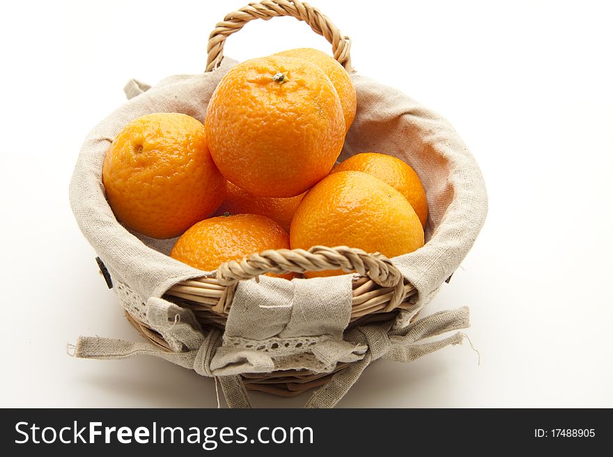 Tangerines in the basket with material