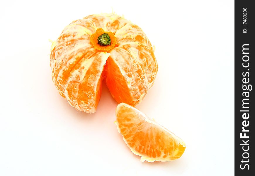 Ripe tangerines lie on a white background