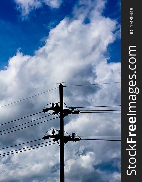 Silhouette light poles on the blue sky background