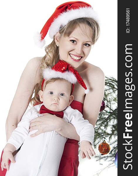 Nice woman and baby in red christmas hats