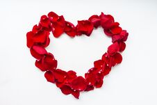 Heart Shaped Red Rose Petals. Greeting Card For The Holiday Royalty Free Stock Photo