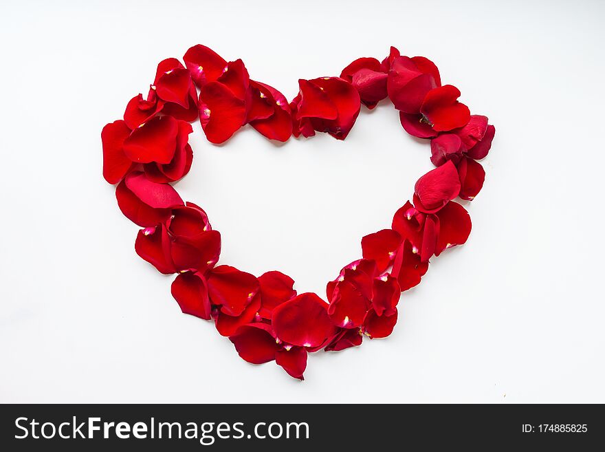 Heart Shaped Red Rose Petals. Greeting Card For The Holiday