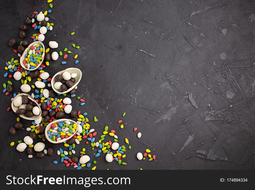 Chocolate Easter Eggs And Sweets On Dark Background.