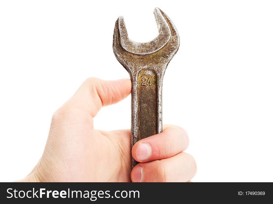 Hand holding spanner; wrench. Repair. Isolated