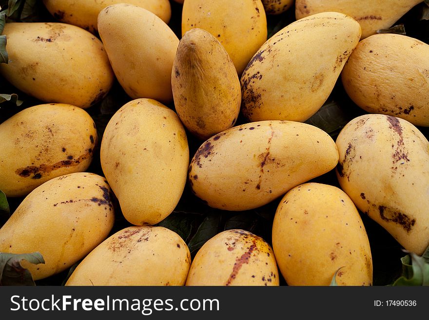 Details of golden mangoes background