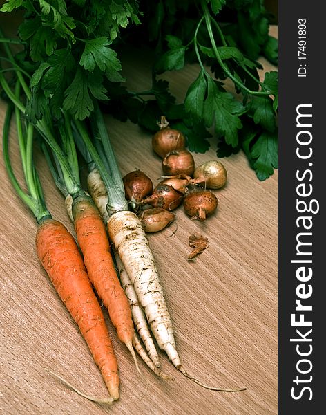 Fresh vegetables on a wooden background.